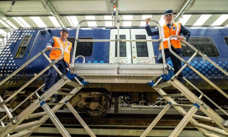 Scotland rail workers pose with Abellio carriage